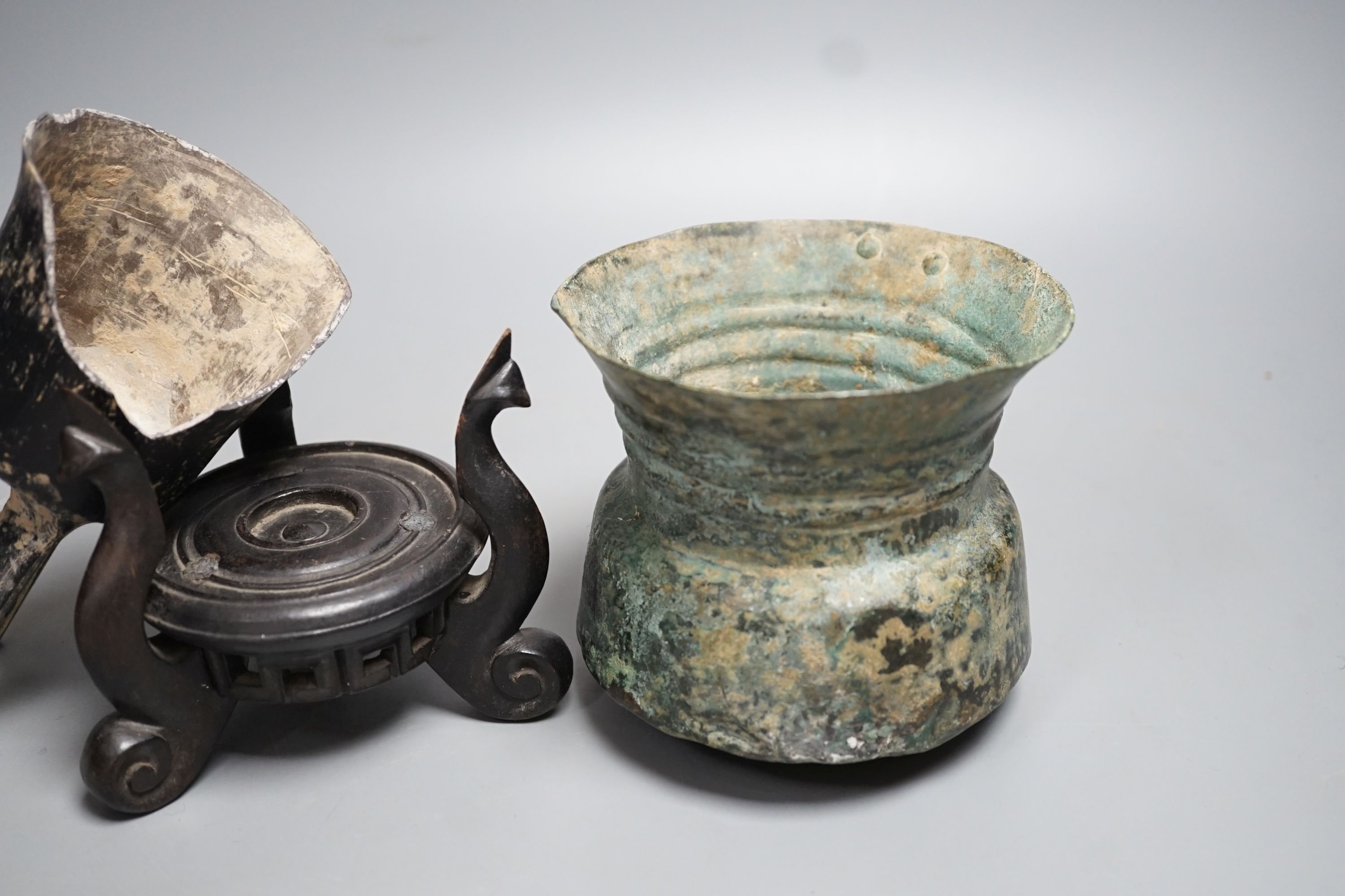 A Han dynasty pottery tripod vessel and a Roman jug